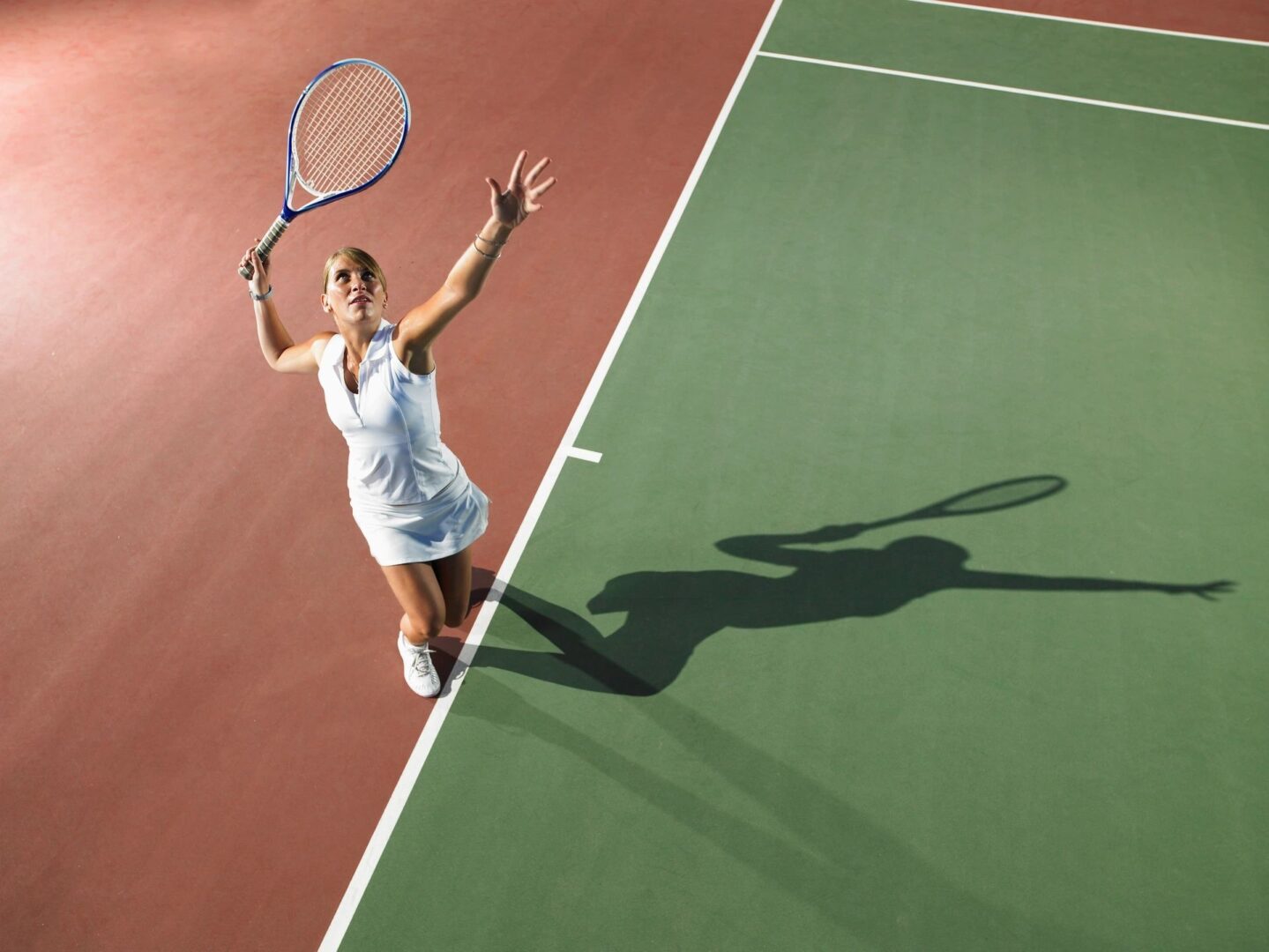 Woman preparing tennis serve